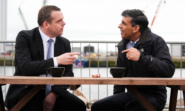 Douglas Ross and Rishi Sunak talking over tea.