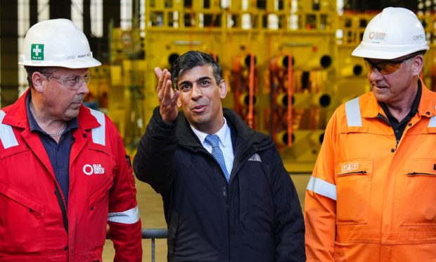 Rishi Sunak speaking to fabrication workers at Port of Nigg, near Inverness. Image: Shutterstock.