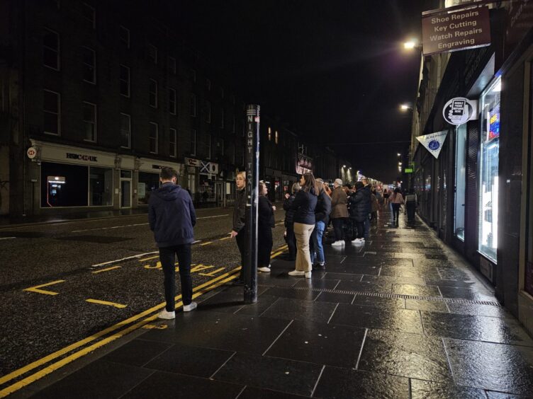 A queue of people waiting for a taxi at the Union Street night-time rank in Aberdeen in February. 