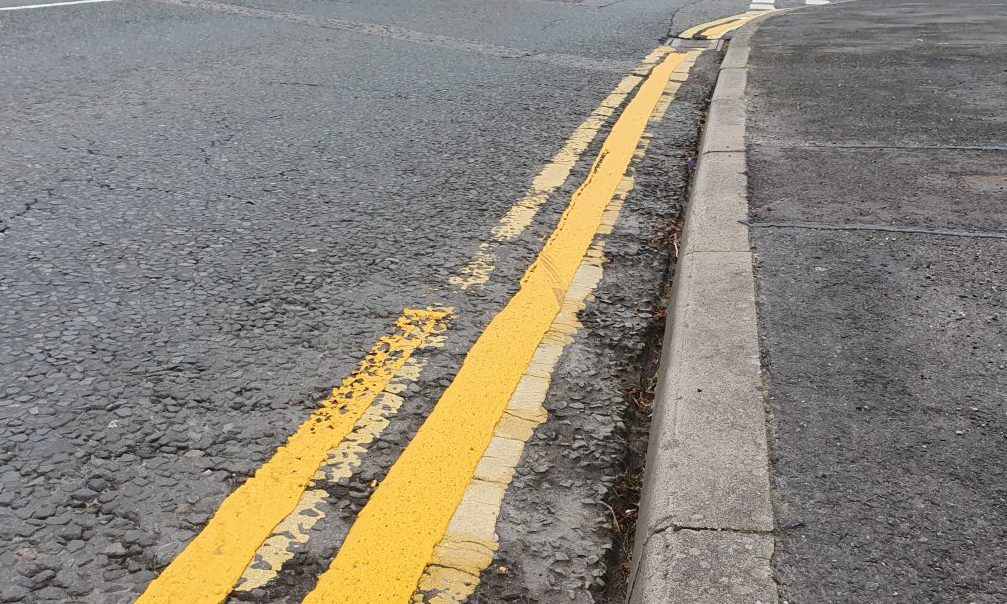 Faded double yellow lines. 