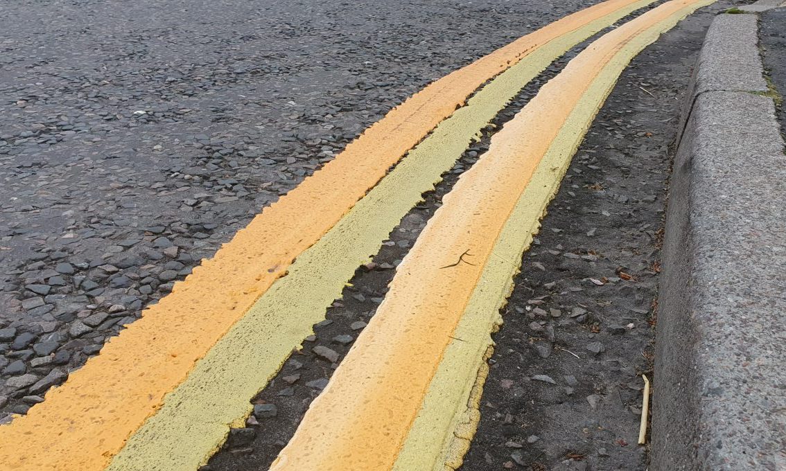 Curved double yellow lines. 