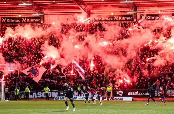 The youngster had been travelling to Dens Park with flares and smoke bombs. Image: Rob Casey/ SNS.