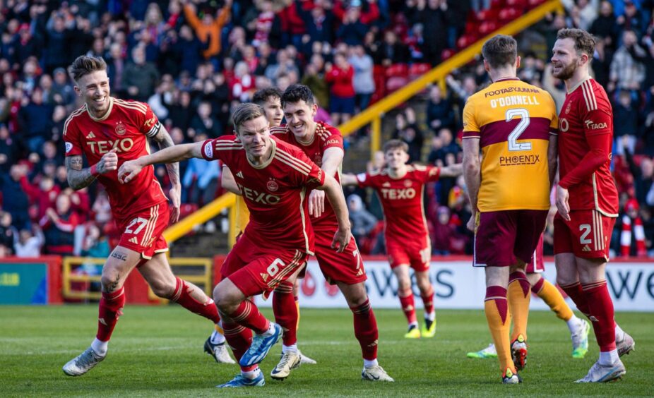 Aberdeen's Stefan Gartenmann celebrates with Jamie McGrath after scoring to make it 1-0 during the home Premiership win over Motherwell. Image: SNS.