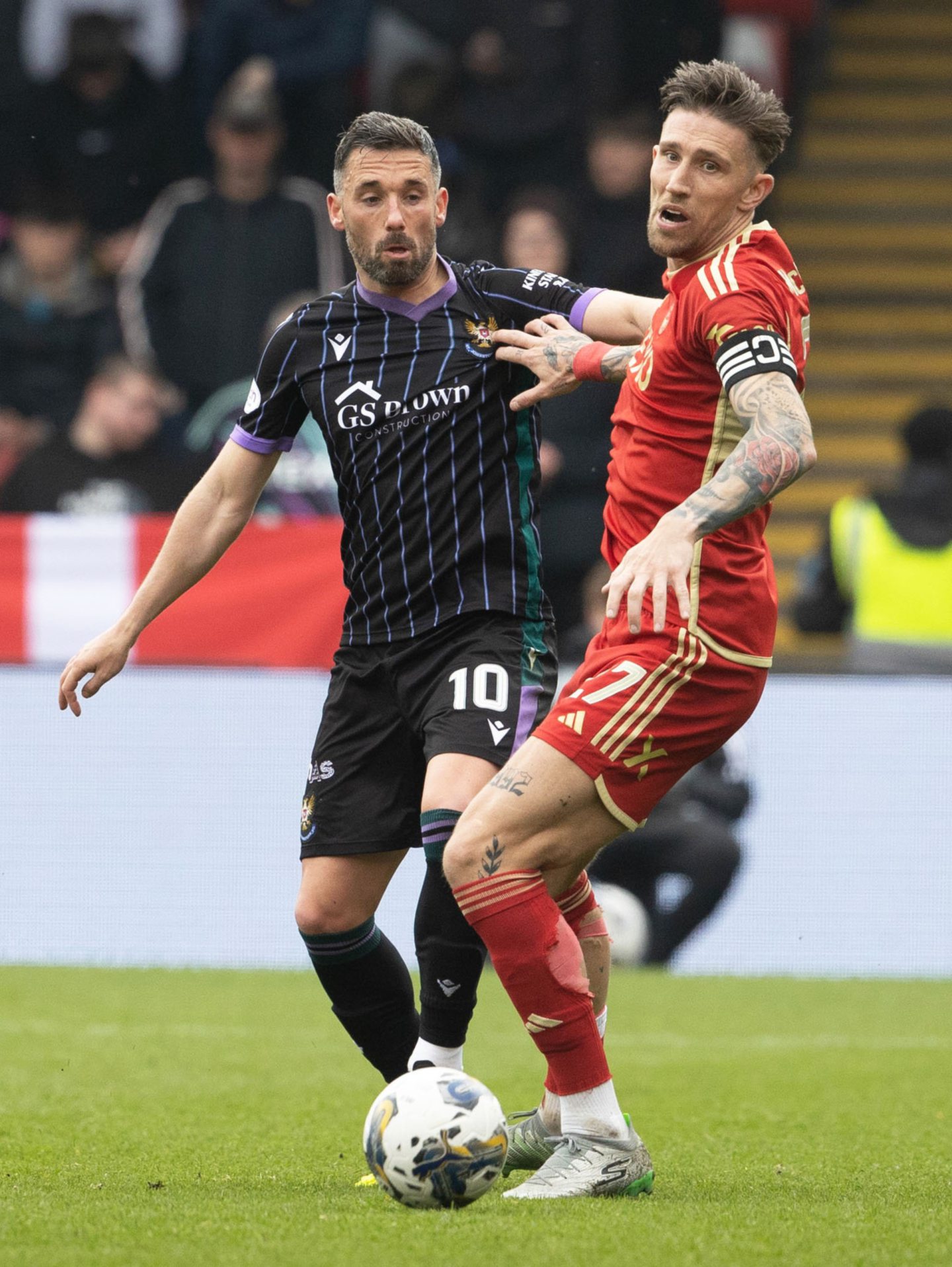 St Johnstone's Nicky Clark and Aberdeen's Angus MacDonald in action. Image: SNS 