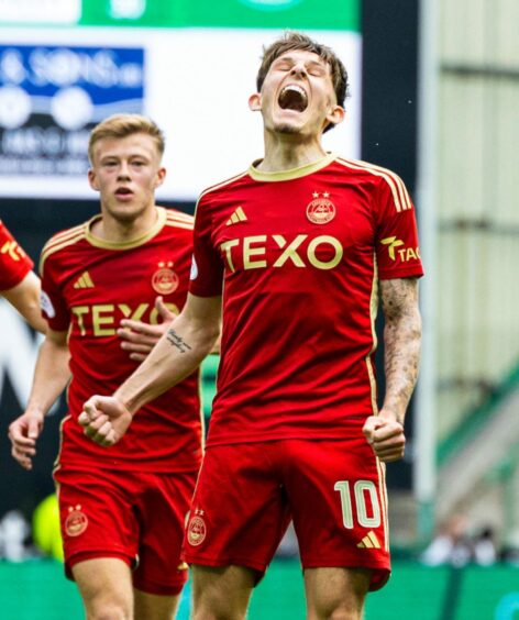 Aberdeen's Leighton Clarkson celebrates wearing the 2023/24 home kit as he scores to make it 1-0 in the Premiership match against Hibs at Easter Road.