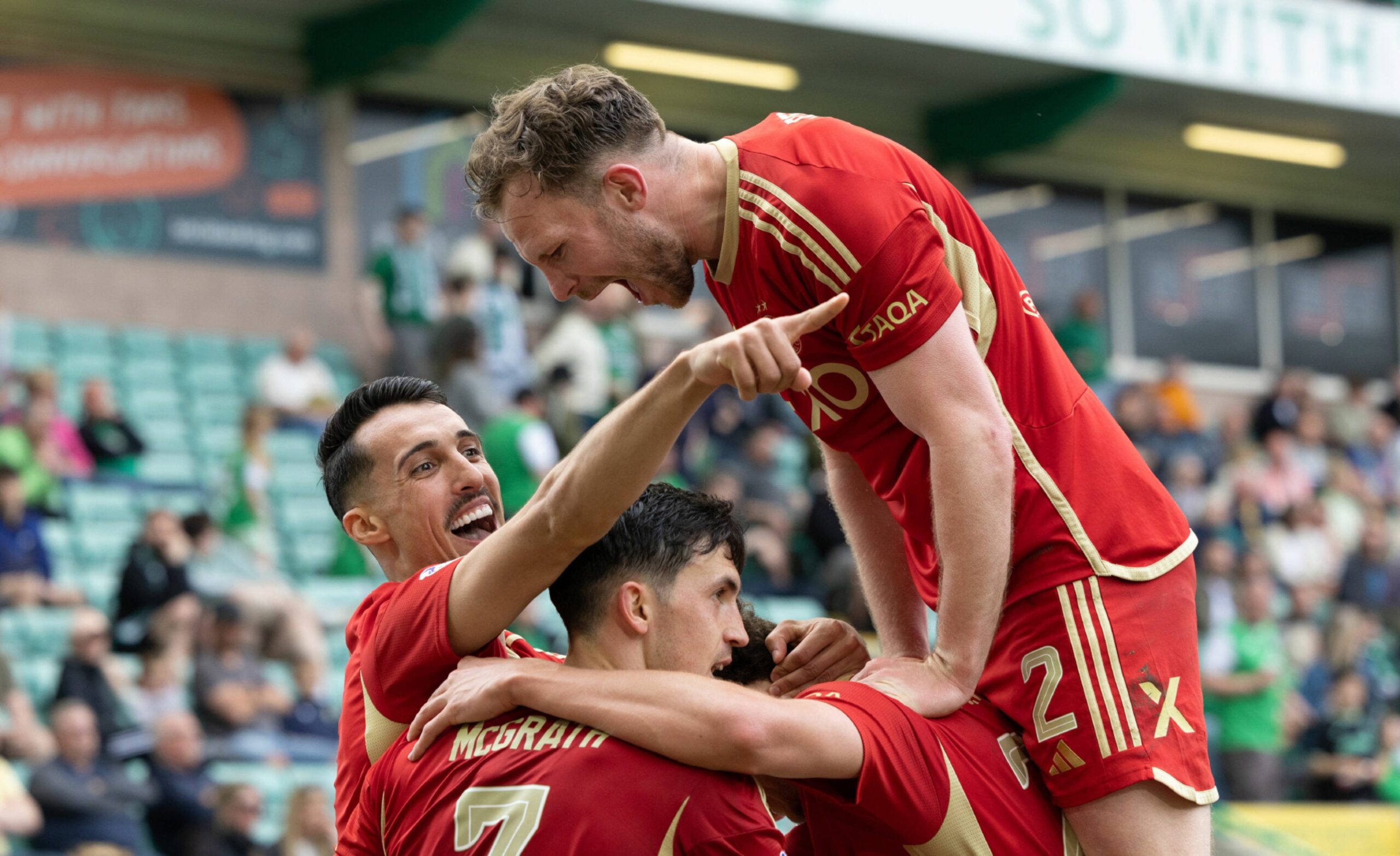 Aberdeen's Bojan Miovski celebrates with Nicky Devlin as he scores to make it 3-0 against Hibs at Easter Road.
