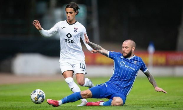 Ross County's Yan Dhanda, left, and St Johnstone's Stevie May in action during the 1-1 draw at McDiarmid Park. Image: SNS.