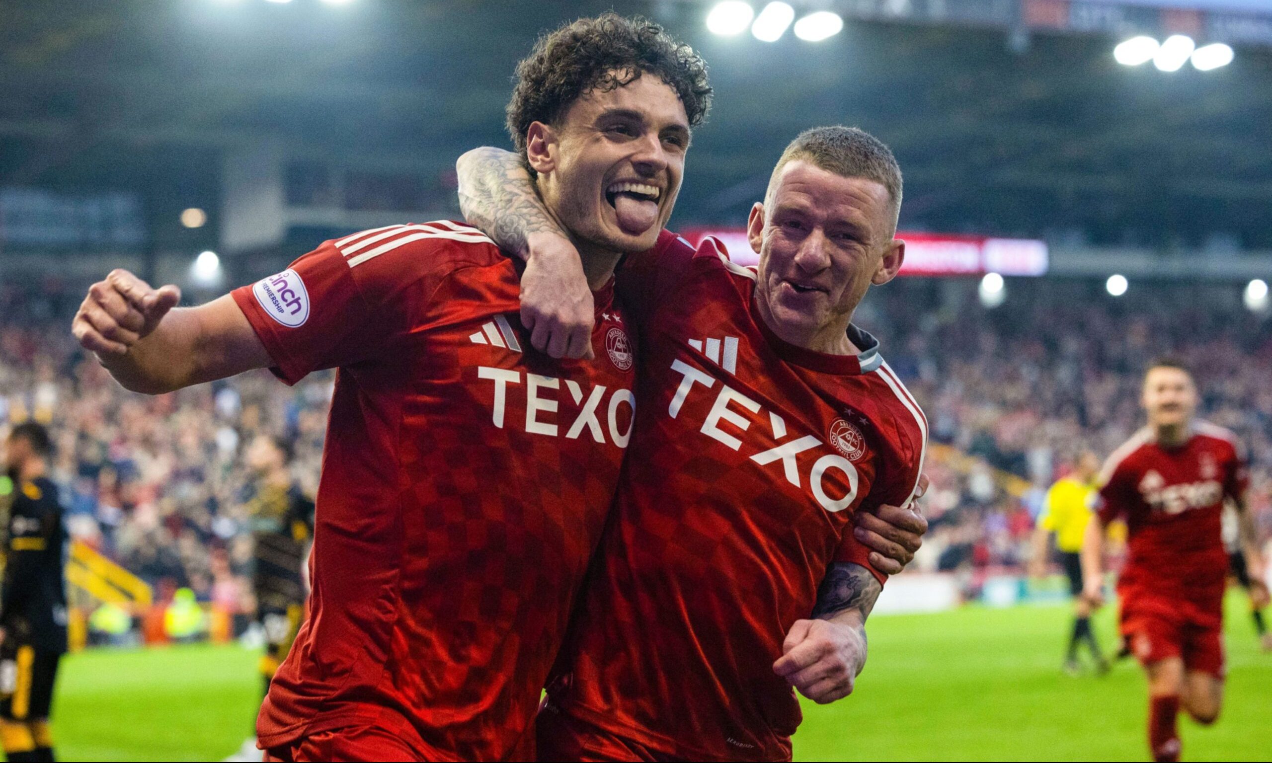 Aberdeen's Dante Polvara celebrates with Jonny Hayes after scoring to make it 3-1 against Livingston. Image: SNS