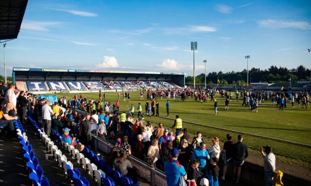 The full-time pitch invasion following Caley Thistle's play-off final defeat against Hamilton Accies. Image: SNS.