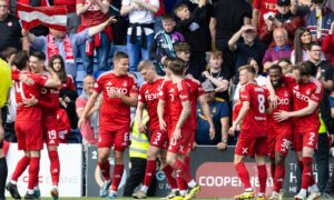 Aberdeen's Jamie McGrath celebrates with teammates after scoring to make it 2-1 against Ross County. Image: SNS.