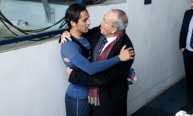 Ross County chairman Roy MacGregor embraces Yan Dhanda. Image: SNS