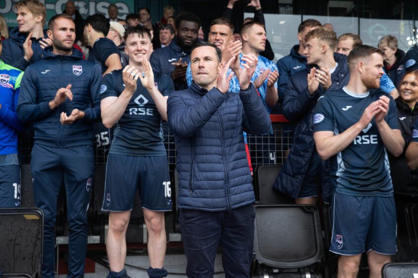 Don Cowie applauds Ross County fans after leading his side to Premiership safety on Sunday.