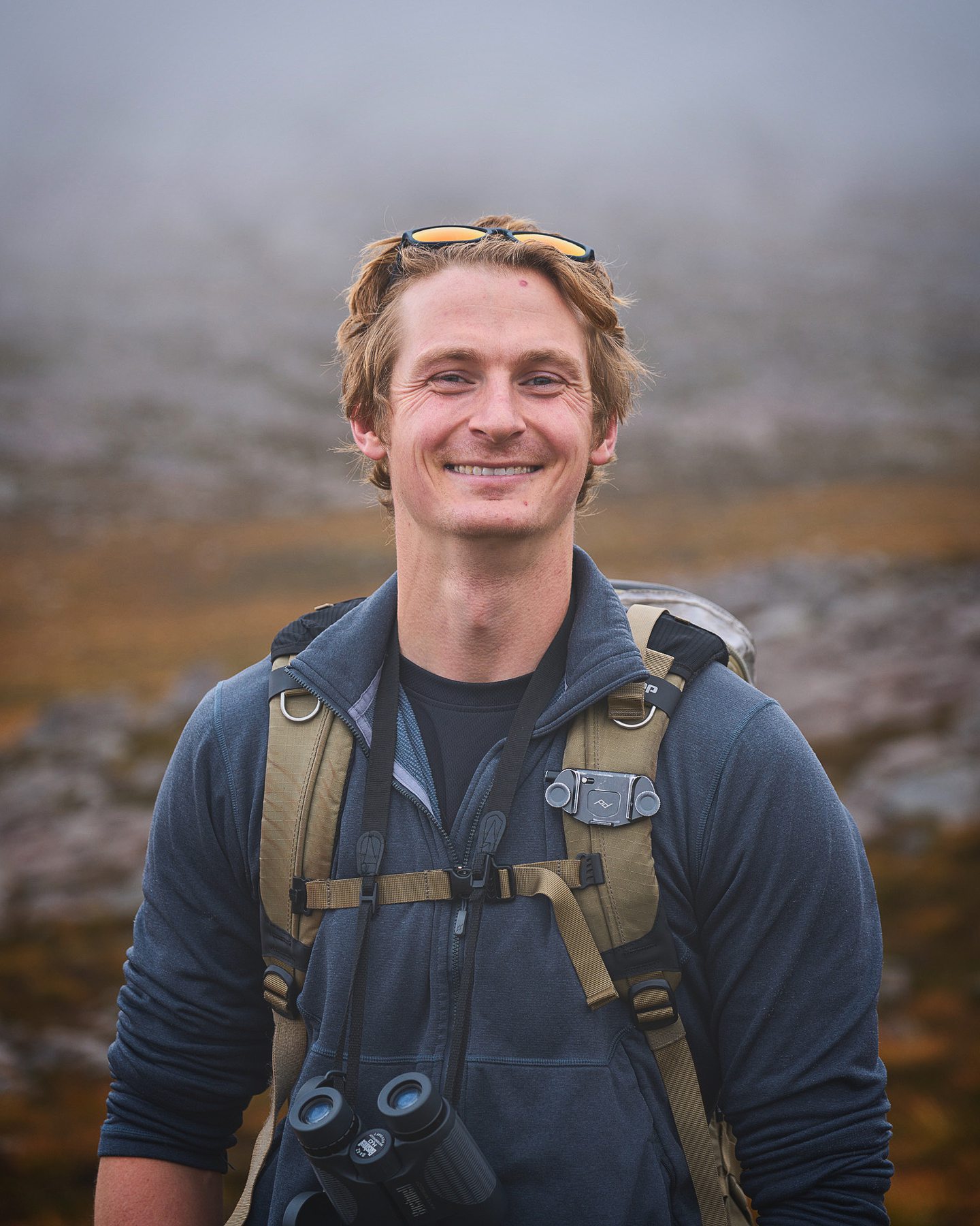 Will Hall smiling at the camera outdoors