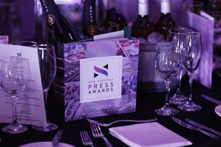 Scottish Press Awards programme on dinner table 