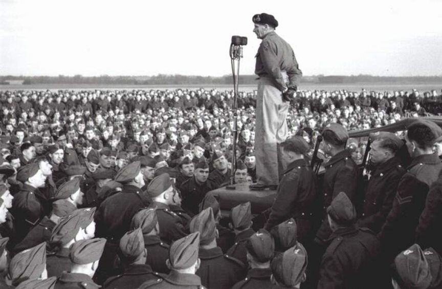 Montgomery addressing the 3rd Division at Brackla airfield in 1944 prior to D Day. He is standing on a Landrover surrounded by a sea of troops.