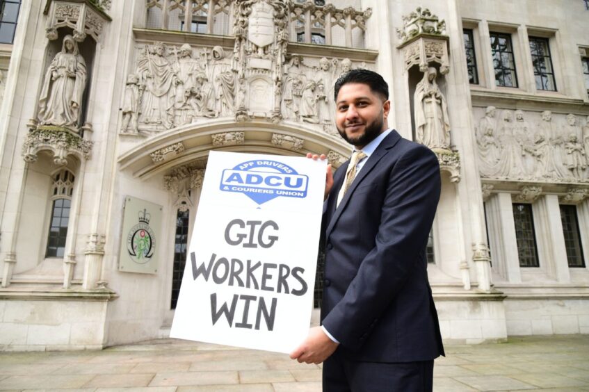 Uber driver Yaseen Aslam outside the Supreme Court in London in 2021.