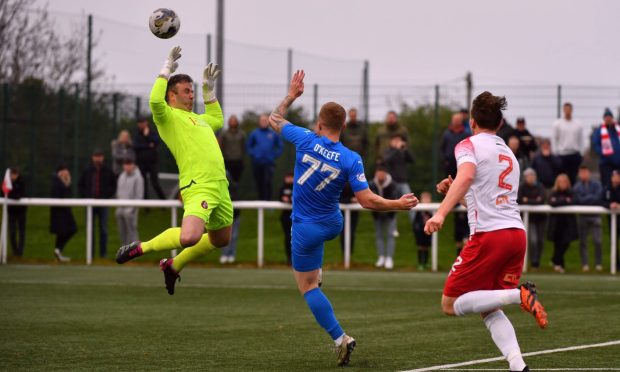 Peterhead's Conor O'Keefe opens the scoring against Spartans. Image: Duncan Brown.