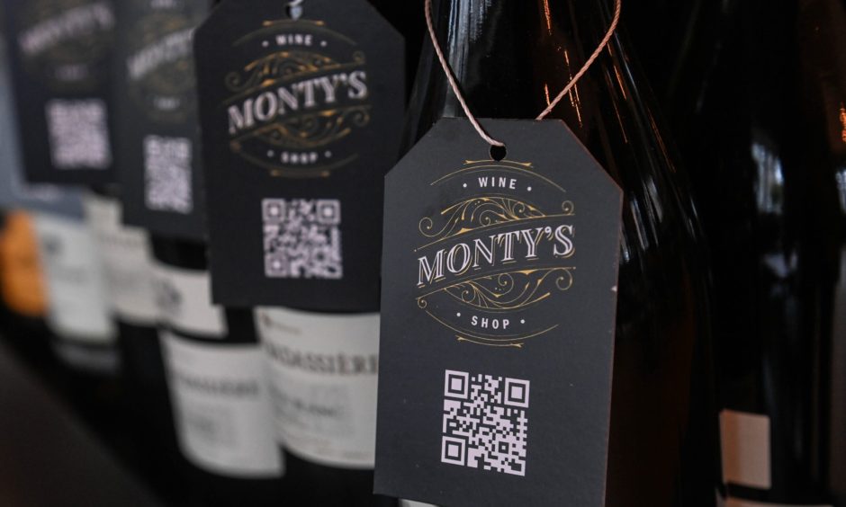 Image show wine bottle lable spelling out Monty's at the new Monty's wine shop and bar in Aberdeen.