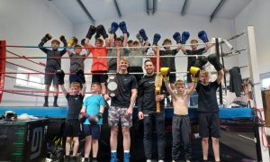 Newly crowned Scottish champion Fraser Wilkinson (l) and Celtic title holder Dean Sutherland (r) and with children from Granite City Boxing Club. Image: DC Thomson