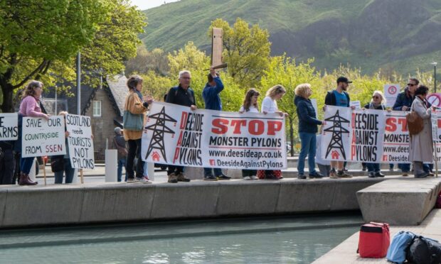 Campaigners protested at Holyrood over 'super pylons'.