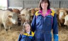 Elaine Duguid pictured on the farm with daughter Addison.