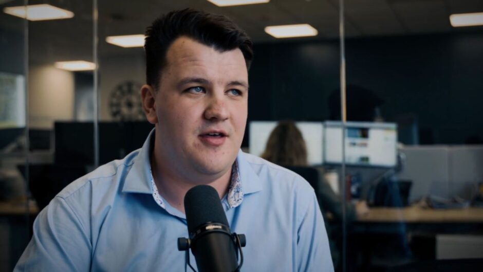 Journalist Finlay Jack wearing a blue shirt. 