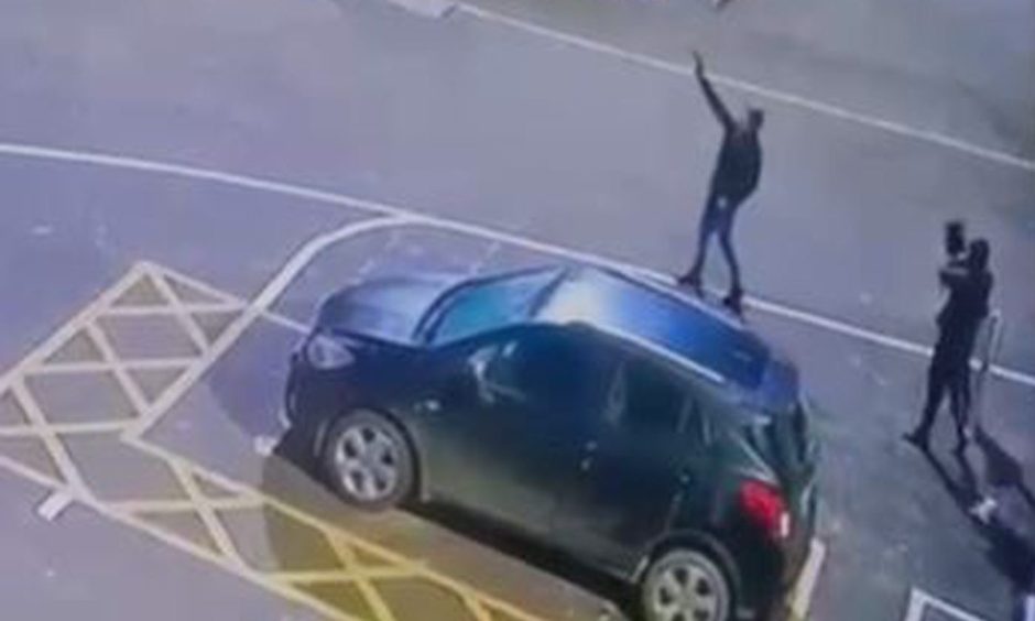 A screen grab of a videos tha is circulating that appears to show men with guns in Fraserburgh.