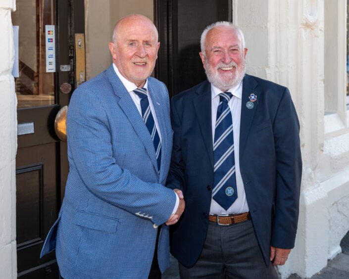 Sandy Sinclair with outgoing Highland League president George Manson.