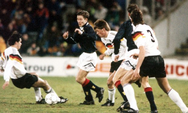 Aberdeen's Eoin Jess (second left) in the thick of the action for Scotland against Germany at Pittodrie.
Image: DC Thomson.