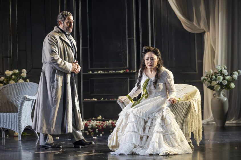 Hye-Youn Lee as Violetta Val?ry and Phillip Rhodes as Giorgio Germont in Scottish Opera's production of La traviata.