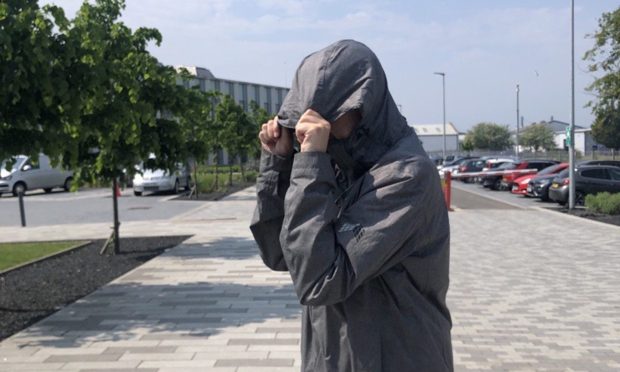 David Wallace outside Inverness Sheriff Court for a previous hearing into an assault charge in 2016. Image: DC Thomson