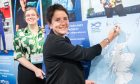 Rural Affairs Secretary Mairi Gourgeon becomes the latest politician to sign a pledge to support Scottish fishing and coastal communities.
