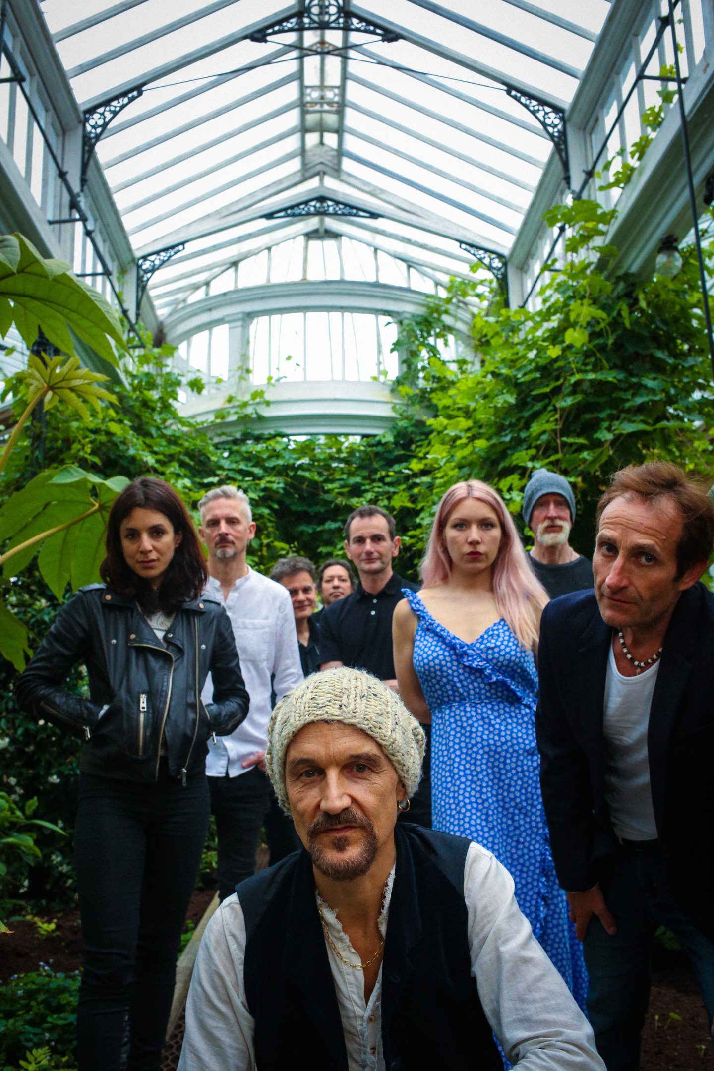 James standing in a room surrounded by plants