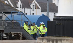 Police in Kirkwall Harbour after a body was found.