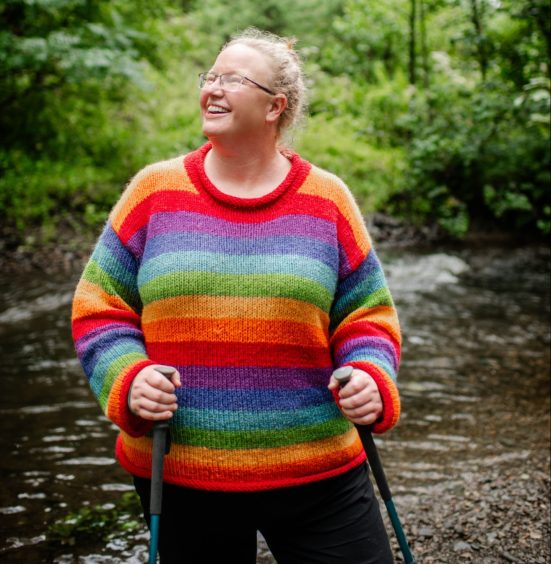 Dr Kerri Andrews on a walk in the countryside.