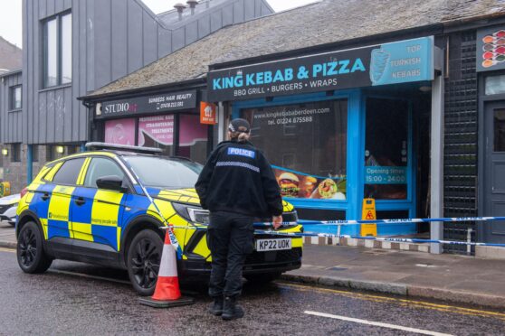 Police outside King Kebab in Torry.  Image: Kenny Elrick/DC Thomson.