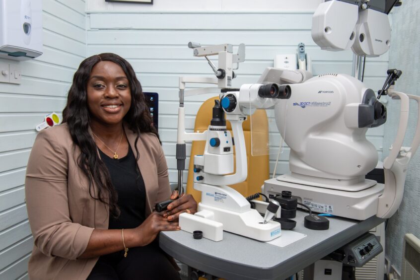 Christy Asalor with optometrist equipment at the Ballater practice 