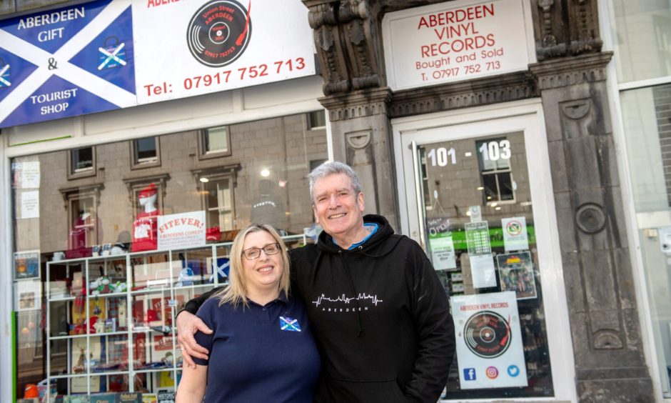 Angela and Bob Smith outside their gift and tourist shop on Union Street.