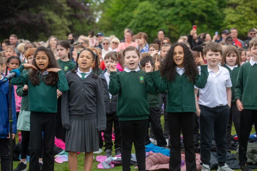 Pupils show off their dance moves in front of huge crowd.