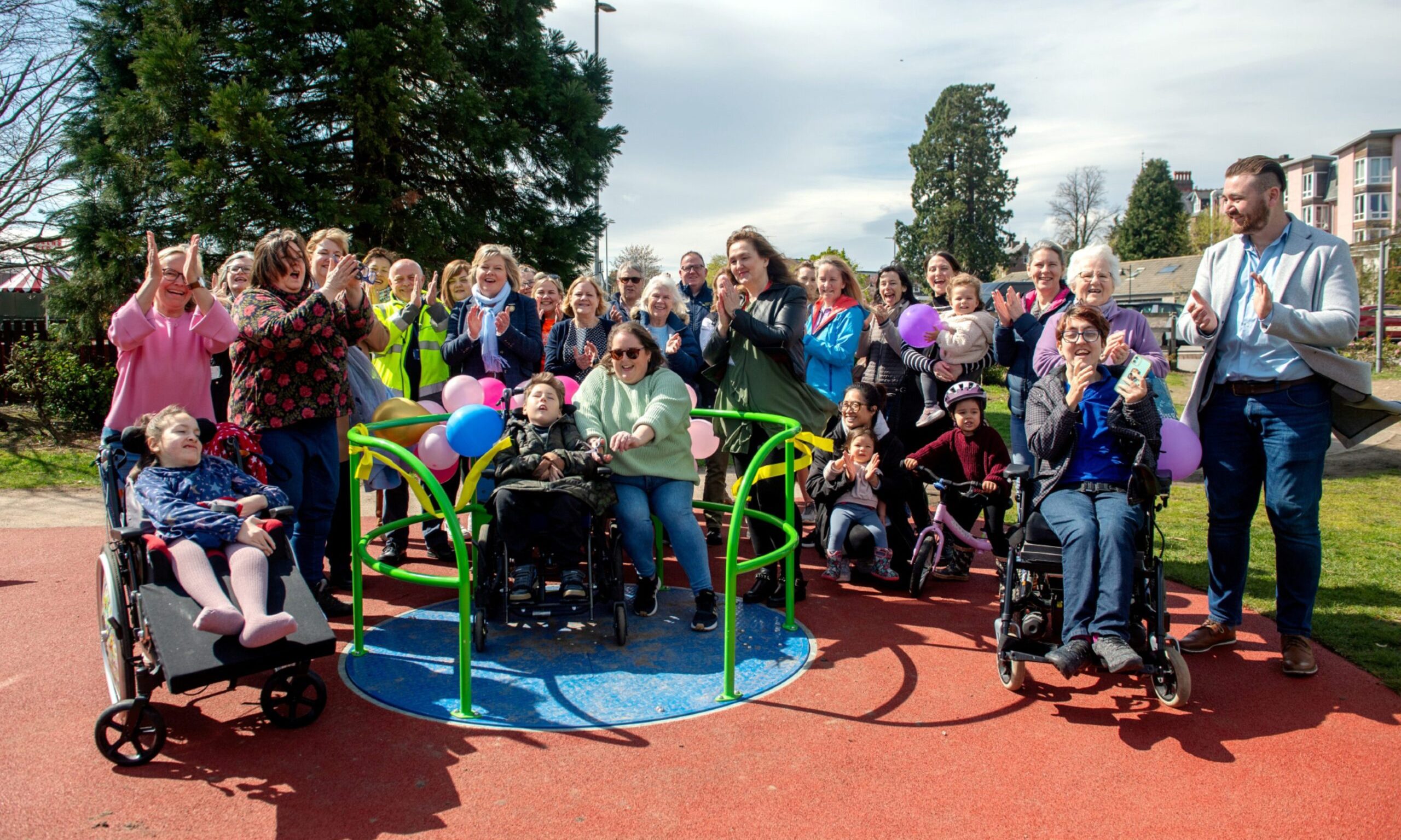 Families and friends at the opening of the new wheelchair-accessible playpark at Bellfield Park in Banchory.