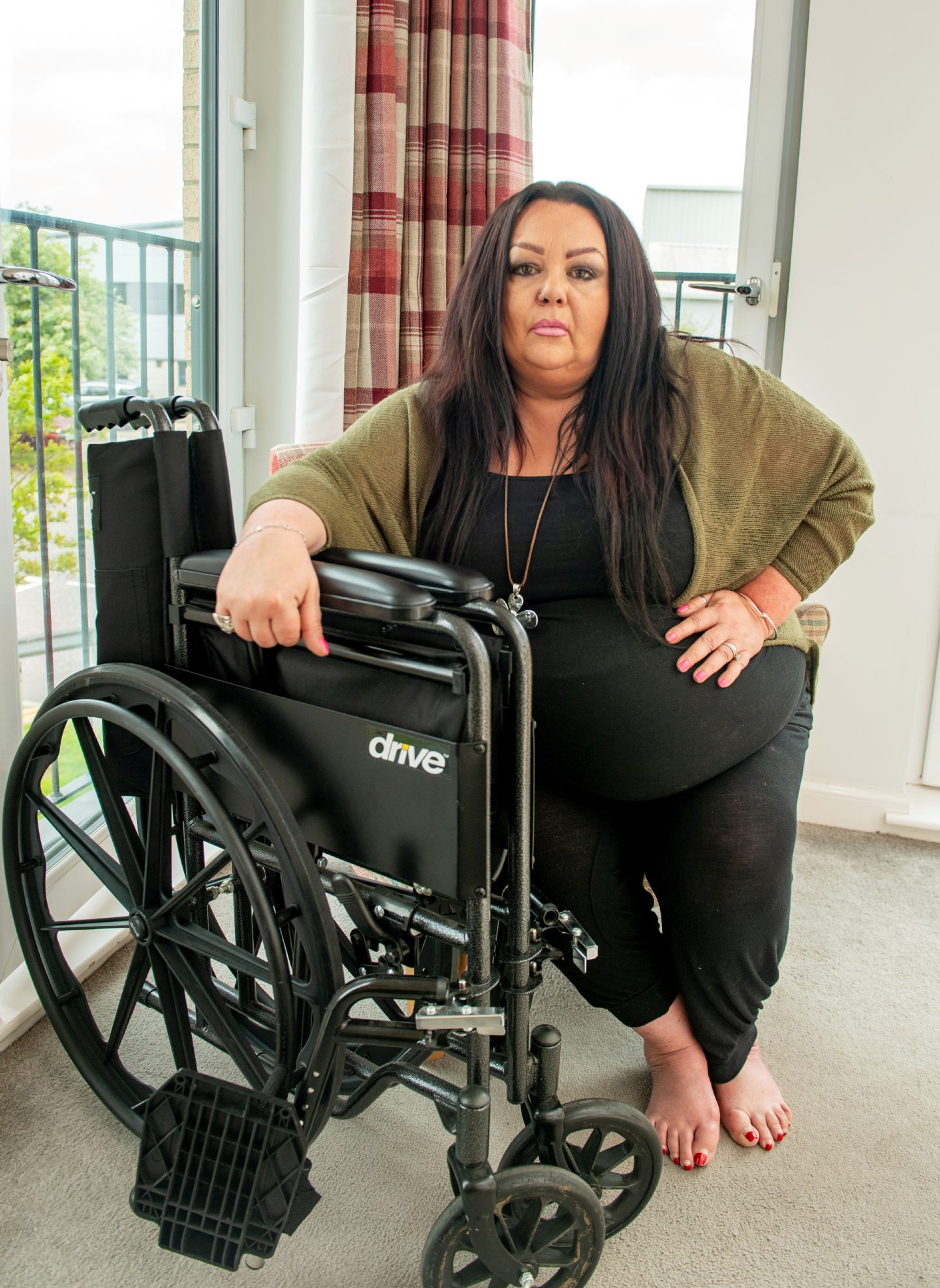 Suzi with her wheelchair.