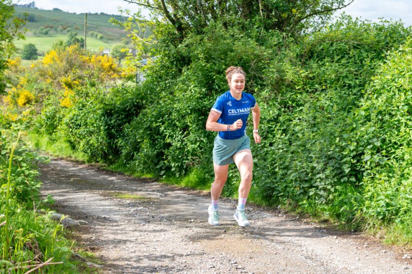 Eilidh Prise training for a Triathlon