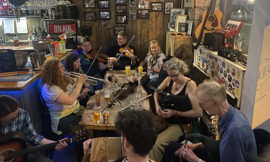 A traditional music session happening in MacGregor's