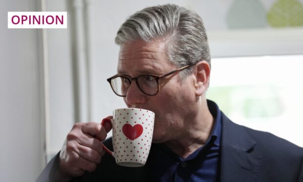 Labour leader and prospective prime minister Sir Keir Starmer sips a cuppa on the campaign trail. Image: Jacob King/PA Wire