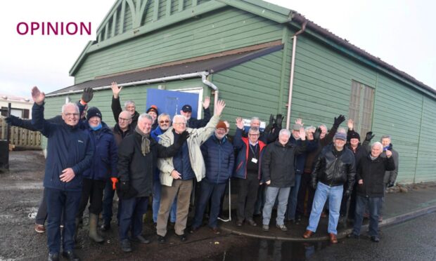 The Stonehaven and District Men's shed group celebrating after signing a lease on the Pavillion in Stonehaven in 2019. The entire charity is now under threat. Image: Chris Sumner/DC Thomson