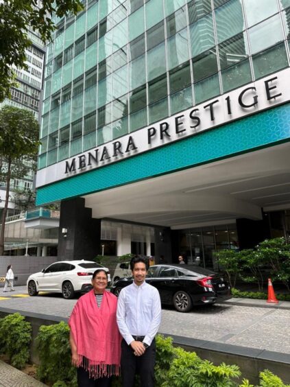 Susan Goonting and Khalid Saufee, administration manager and business development manager respectively, outside Vulcan's new office in Kuala Lumpur, Malaysia.