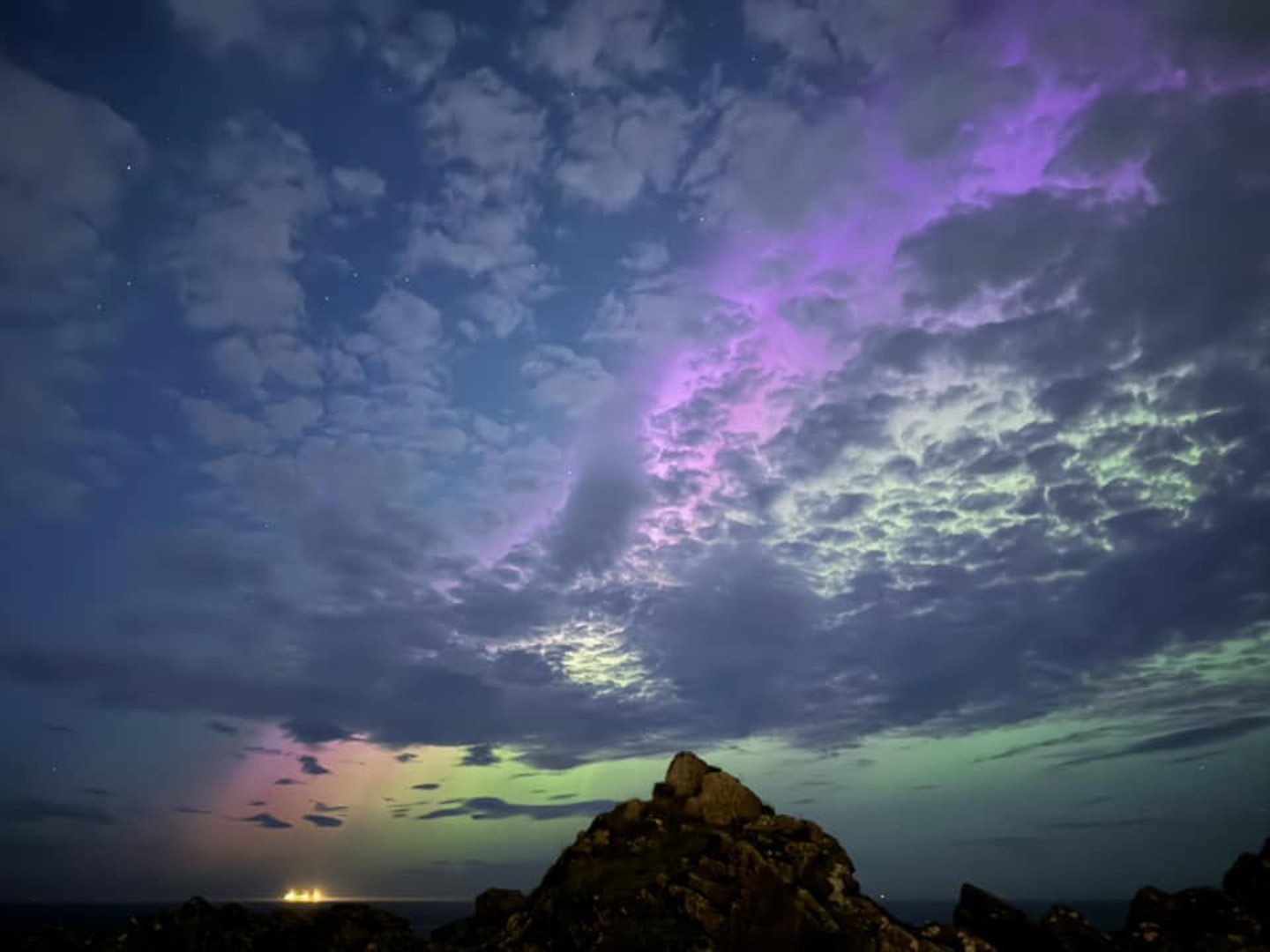 Northern Lights above rock in Cove Bay.