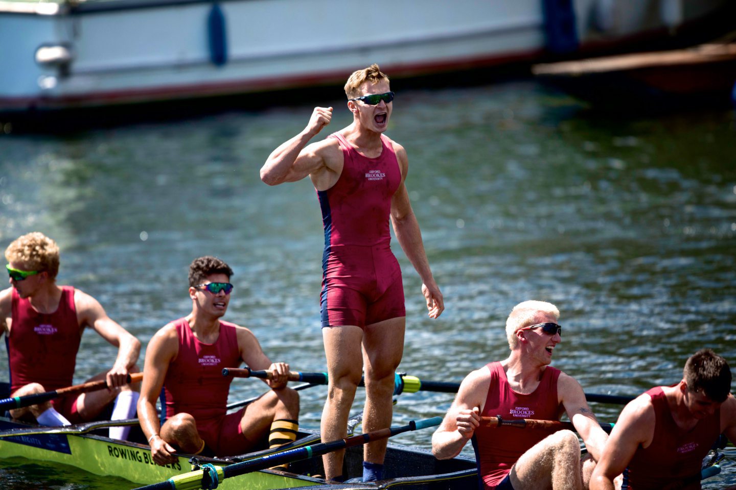 Will Hall celebrating on a row boat