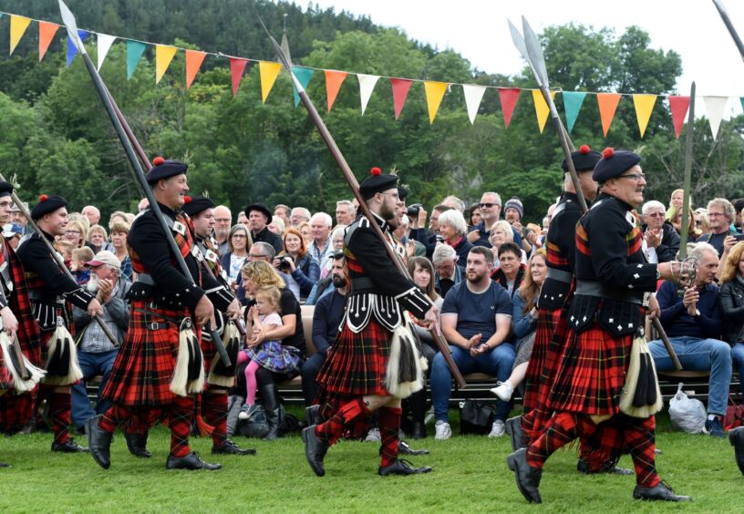 The March of the Lonach Highlanders and Massed Pipe Bands. 