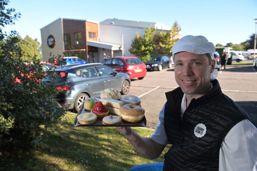 Fraser Gow, a director of Inverness baker Harry Gow with some of his companies products at their Culloden bakery.